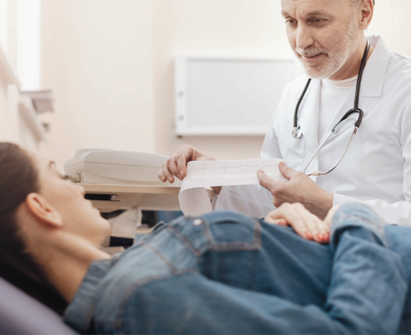 Healthcare professional going over test results with a patient